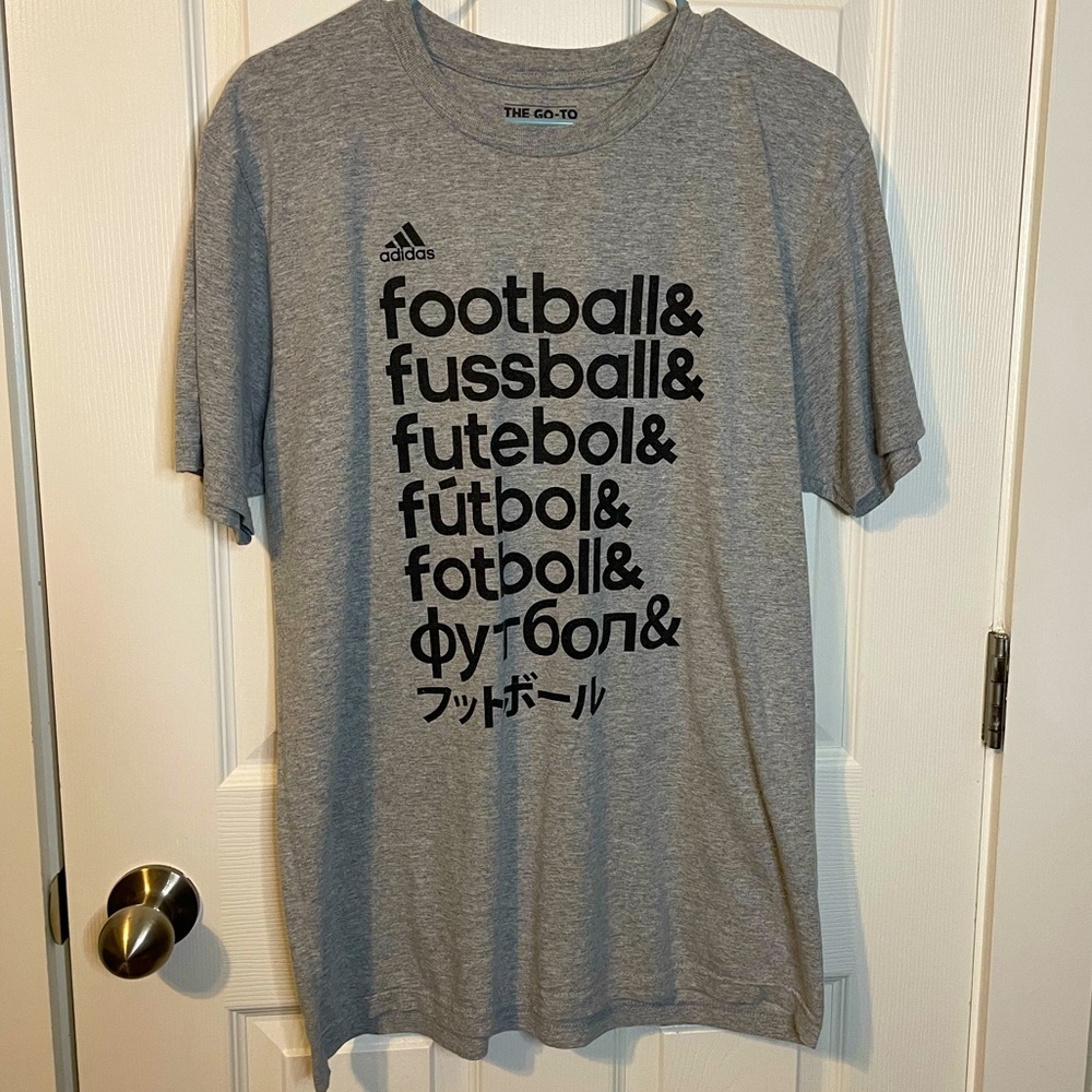 Adidas The Go-To Tee heather gray ‘Football’ in multiple languages on front sz L